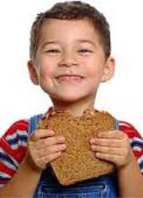 Young boy with peanut sandwich